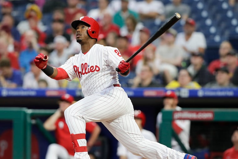 Jean Segura watches his first-inning solo home run against the Arizona Diamondbacks on Monday. It was one of a record 13 dingers in the game.