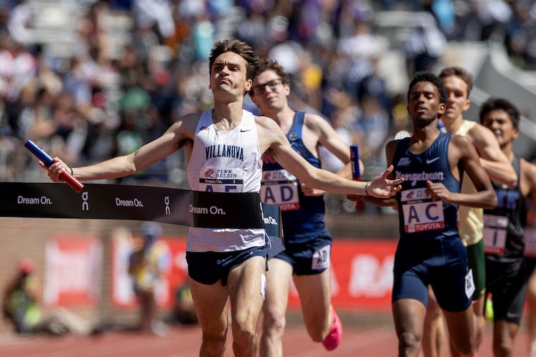 Liam Murphy of Villanova crosses the finish line as Villanova wins the college men's distance medley championship of America at the Penn Relays.