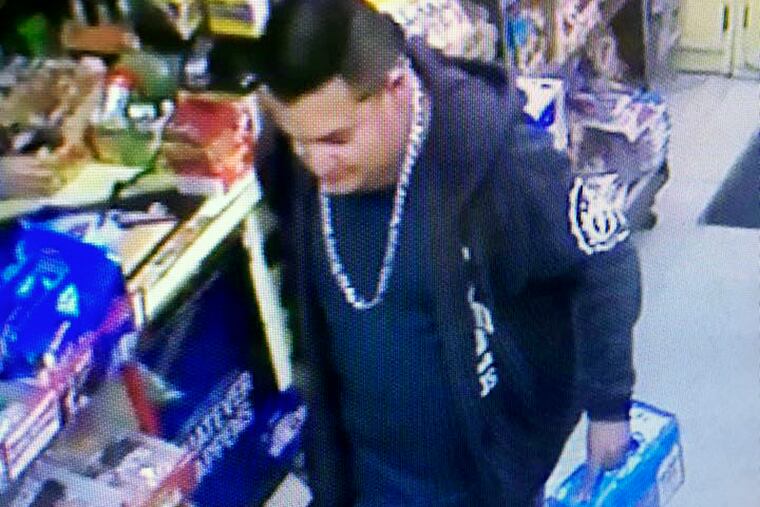 This Wednesday, Dec. 26, 2018 image from a surveillance camera video and provided by the Stanislaus County Sheriff's Department shows a suspect police are searching for in connection to the fatal shooting of an officer during a traffic stop in Northern California. (Stanislaus County Sheriff's Department via AP)