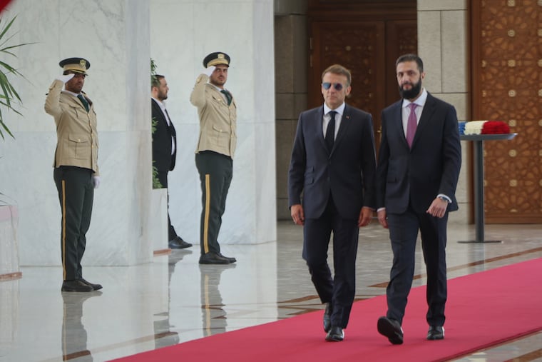 Syrian President Ahmad al-Sharaa, right, meets French President Emmanuel Macron at the presidential palace in Damascus, Syria, Tuesday, July 7, 2026.