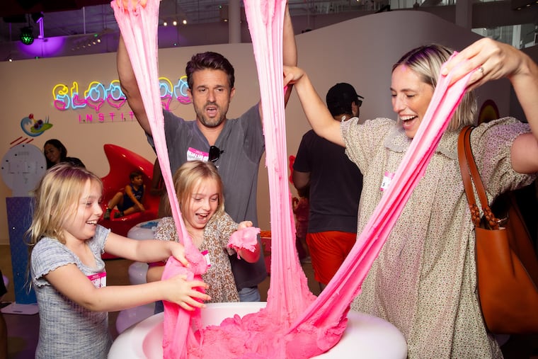 Customers play with slime at the Sloomoo Institute's Los Angeles location. The King of Prussia Mall opened a Sloomoo MiniMoo experience this week.