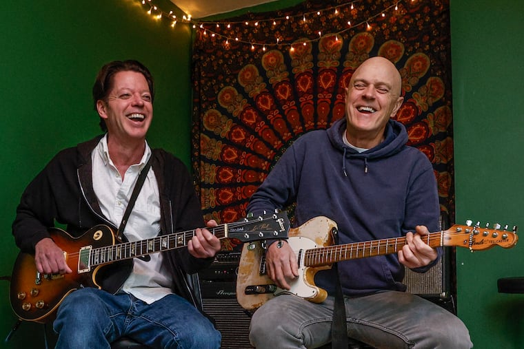 Buzz Zeemer, the Philly power-pop band, is led by singer Frank Brown (left) and guitarist Tommy Conwell, seen rehearsing here in Manayunk on Monday, March 25, 2024.
