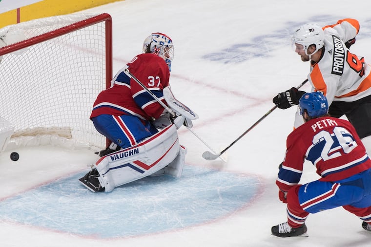 Ivan Provorov scores the winner against Montreal Canadiens goaltender Keith Kinkaid as Jeff Petry defends during overtime.