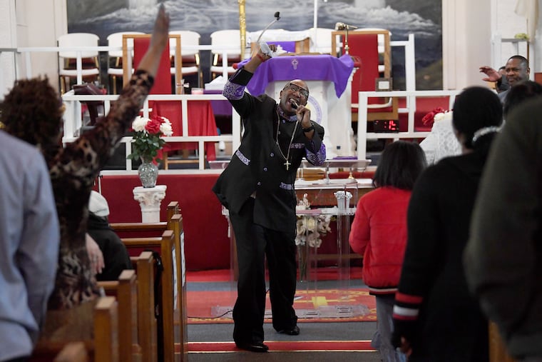 Bishop E.M. Barron preaches at the Higher Ground Temple Church in Camden. He is also the Camden County Metro Police Department's Chaplain.