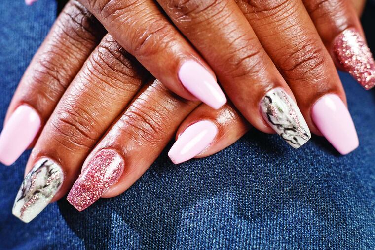 Christine Harris' glitter-accented marble nails, courtesy of Koco Nail Salon. ED HILLE / Staff Photographer