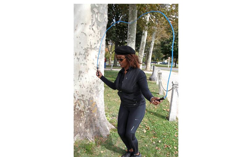 Fitness columnist Kimberly Garrison demonstrating how to use a jump rope in Philadelphia on October 8, 2013. ( DAVID MAIALETTI / Staff Photographer )