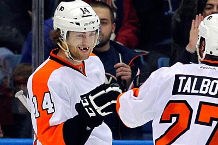 "Lately the bounces are going my way, and it seems like everything I touch is going in," Sean Couturier said. (Paul J. Bereswill/AP)
