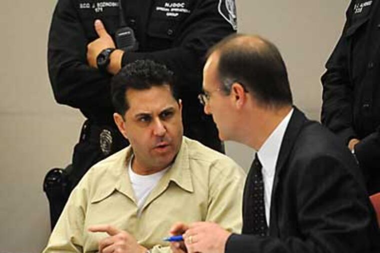 Craig Arno, left, speaks with his attorney Eric Shenkus after his sentencing for the murder of Martin Caballero in Superior Court, Mays Landing, N.J. Thursday, May, 24, 2012. Arno was sentenced to 120 years in prison, and must serve 102 years before becoming eligible for parole. (AP Photo/Press of Atlantic City, Danny Drake)