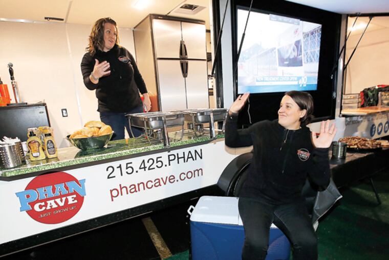 Phan Cave co-founders Jacqueline McDevitt, left, and Colleen O'Hara in the D parking lot at the Wells Fargo Center on Thursday, November 6, 2014. (YONG KIM / Staff Photographer)