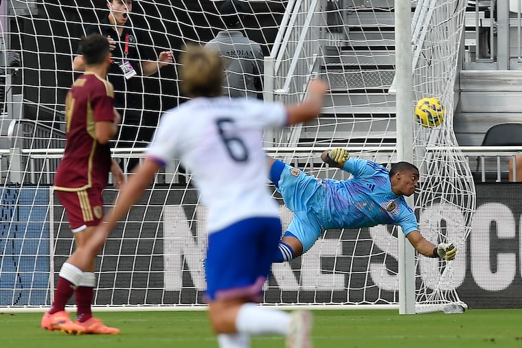 Jack McGlynn's shot from long range flew past Venezuela goalkeeper Wuilker Fariñez (right) to open the scoring in the U.S.' 3-1 win.