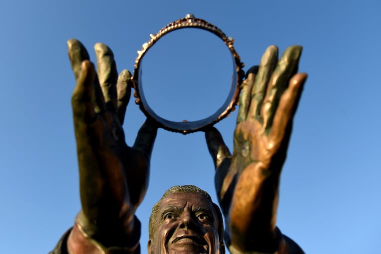 The bronze statue of Bert Parks - Mr. Miss America - in front of the Sheraton Atlantic City Convention Center Hotel. He was the pageant's host from 1955 to 1979, singing the traditional “There she is .
” every year after placing the crown on her head. Scene Through the Lens," features staff photographer Tom Gralish’s visual exploration of our region. The same photo runs in both zones every Monday on B-2. Caption includes header and short URL link to his blog: inquirer.com/sceneontheroad