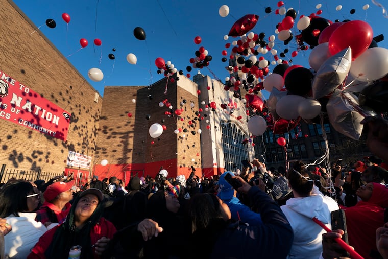 A balloon release outside Simon Gratz High School Mastery Charter in memory of Devin Weedon on Thursday.