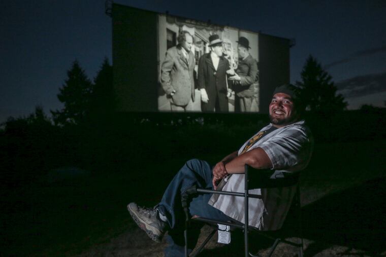 Mahoning Drive-In operator Virgil Cardamone poses with the Three Stooges "Pop Goes the Easel" at a screening July 22. The Mahoning Drive-In was slated to close as a Connecticut solar-energy company eyed its land. But a grassroots push by the drive-in's legions of fans convinced the company to abandon the plan.
