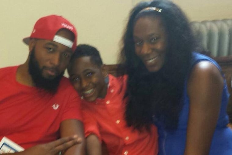 Fatal police shooting victim David Jones (left) is shown last year with former girlfriend Tiffanie Dunschee Luke and her son, T’khai Dunschee.