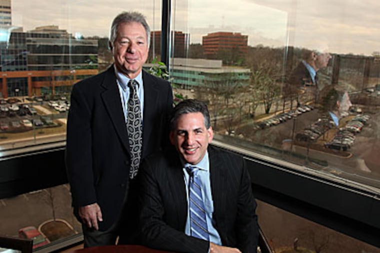 Lawyers Joe Manko, left and Robb Fox in their Bala Cynwyd office. (Laurence Kesterson / Staff Photographer)
