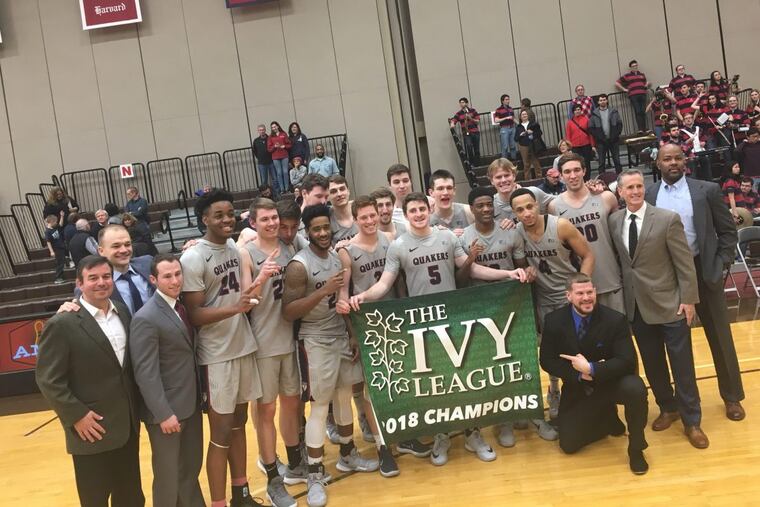 Penn basketball with their banner.