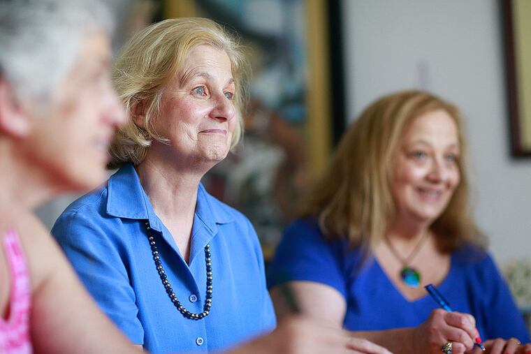 Group members Mary Elizabeth Pfeil (center) and Tobie Schupack at a gathering. Schupack, who lost her husband of 35 years in 2011, says the writing has helped her move forward.