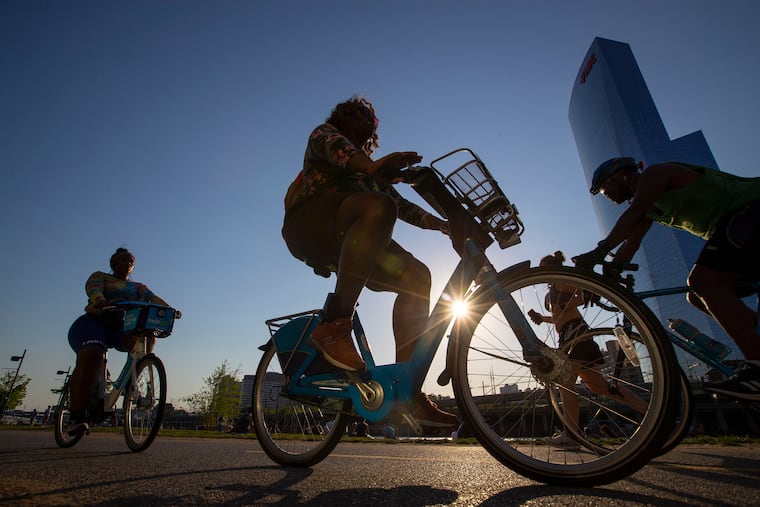 Bikers enjoy a summer-like break in the weather last month along the Schuylkill River Trail. Forecasters say the summer will be a hot one. We'll see.