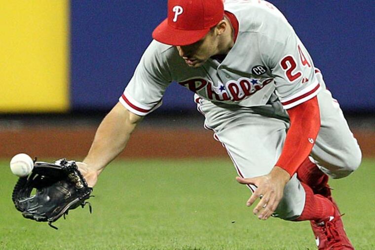 Philadelphia Phillies left fielder Grady Sizemore (24) drops a pop-fly hit by New York Mets center fielder Juan Lagares (not pictured) allowing two runs to score during the seventh inning of a game at Citi Field. (Brad Penner/USA Today)