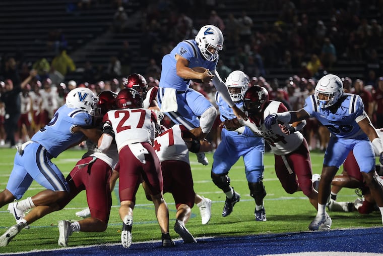 Connor Watkins hurdles his way into the end zone during the second quarter against Colgate.