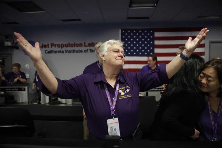 Flight director Julie Webster reacts in mission control at NASA's Jet Propulsion Laboratory in Pasadena, Calif., after confirmation of Cassini's demise Friday.
