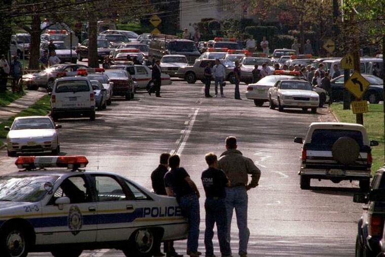 Police near the shooting scene in Haddon Heights in 1995, where two officers - Camden County investigator John McLaughlin and Heights patrolman John Norcross, were gunned down.