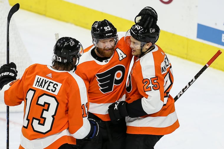 Jake Voracek (93) celebrates a goal with Kevin Hayes (13) and James van Riemsdyk (25) during a preseason game against the Islanders. Voracek and he Flyers open the season Friday in his homeland, the Czech Republic, against Chicago.