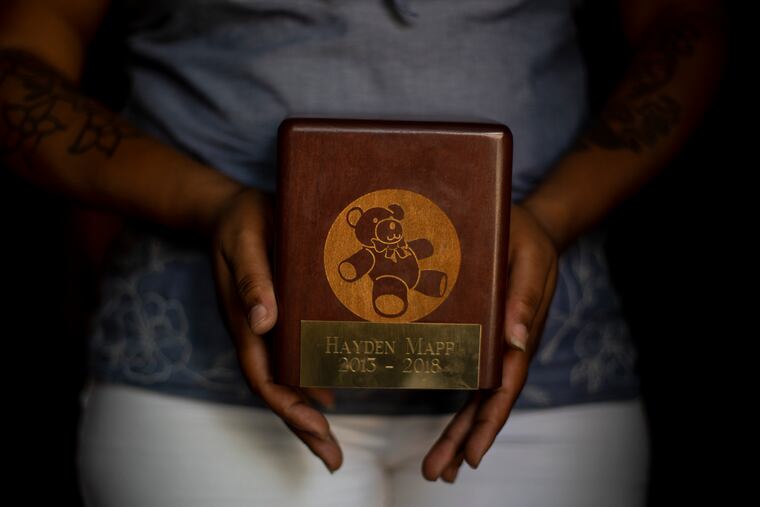 Nina Mapp of North Philadelphia holds a picture of her with her son, Hayden Mapp, who died last year while living at Pediatric Speciality Care at Philadelphia. "There was never a dull moment with Hayden," Nina said. "He told me I was strong."