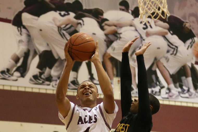 Senior standout James Simples (left) of Lower Merion in a game earlier this season. Lower Merion and Wilson-West Lawn will play a PIAA Class 6A tournament game at a site to be determined after Coatesville declined to host the game on Wednesday night..