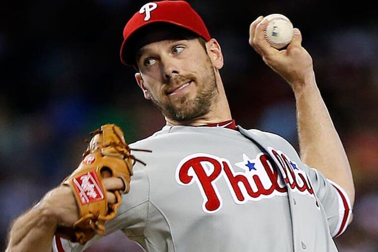 Philadelphia Phillies pitcher Cliff Lee delivers against the Arizona Diamondbacks during the first inning of a baseball game on Saturday, May 11, 2013, in Phoenix. (AP Photo/Matt York)