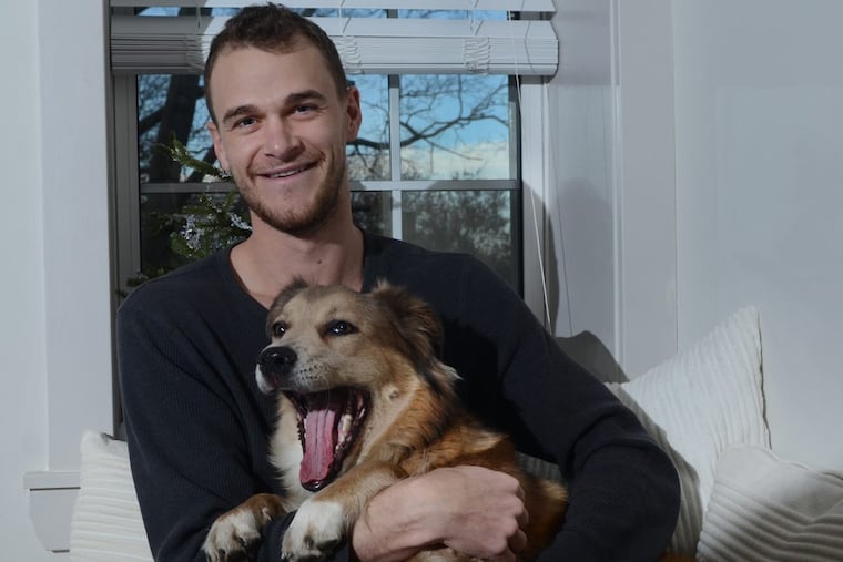 Haddonfield resident, Tom Turcich poses for a portrait with his dog Savannah at his home in Haddonfield, N.J. Wednesday, December 20, 2017. Turcich and his dog Savannah were nearly halfway through a five year seven continent walk chronicled on instagram as @theworldwalk to 25K fans. Then, he went silent, only to pop up in the Pine Barrens, and then at home in Haddonfield, where he's now stuck while he recovers from a serious illness that caused him to lose 35 pounds.