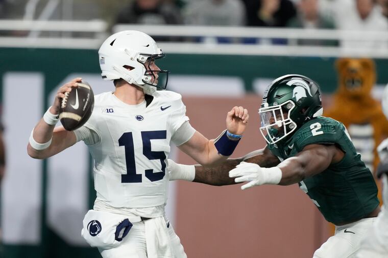 Penn State quarterback Drew Allar is pressured by Michigan State defensive lineman Khris Bogle during the Nittany Lions' romp on Nov. 24.