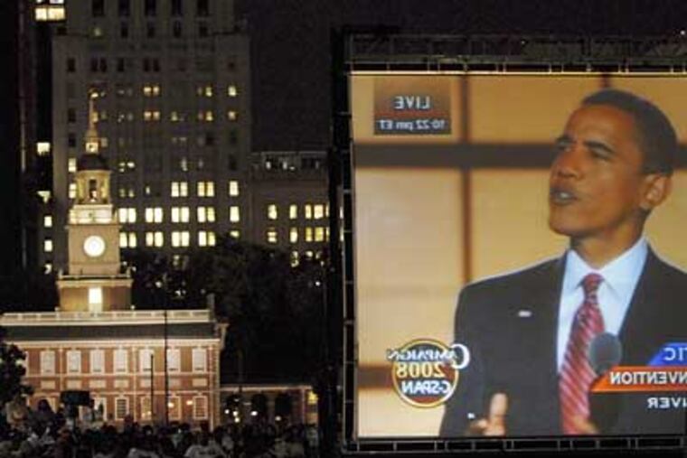 Crowds gathered last night at Independence Hall to watch Barack Obama's acceptance speech. Many local African-American famiilies say that Obama's candidacy has become a turning point in their lives. (Bonnie Weller / Inquirer)