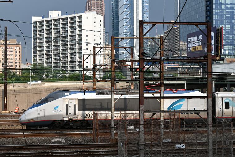 A northbound Amtrak Acela passenger train departs 30th Street Station in Philadelphia.