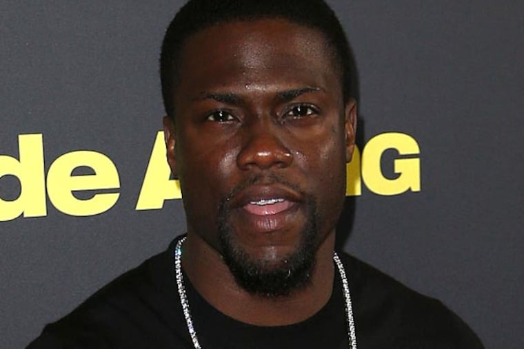 Kevin Hart poses for photos on the red carpet during the premiere of his new movie "Ride Along" in Sydney, Australia. (AP Photo/Rob Griffith)