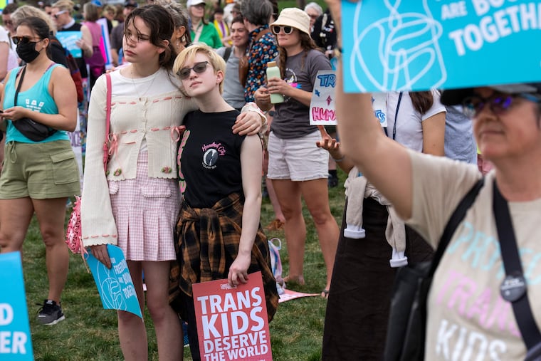 A rally for the Trans Day of Visibility, on the National Mall in Washington, in March. Right-wing demonization of trans and nonbinary people has become pervasive and must be addressed, writes Ashley C. Rondini.