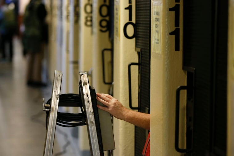 An incarcerated person makes a phone call from San Quentin State Prison in California in 2015.
