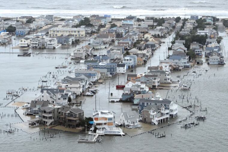 Portion of West 27th Street in Ship Bottom, N.J., on Long Beach Island is underwater Tuesday, Oct. 30, 2012, a day after Hurricane Sandy blew across the New Jersey barrier islands. ( CLEM MURRAY / Staff Photographer )