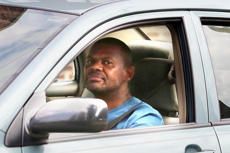 Val Barkley, a janitor at Health Center No. 6, drives into the health center parking lot Wednesday, August 6, 2014. (Stephanie Aaronson/Philly.com)
