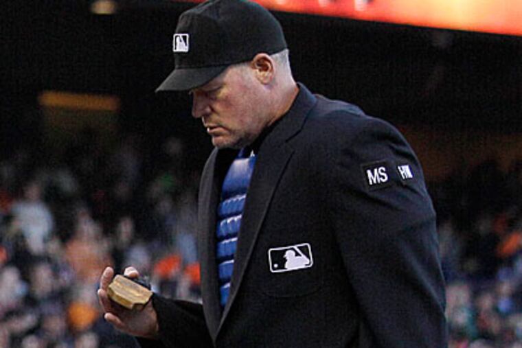Ted Barrett has been the home plate umpire in two different perfect games. (Jeff Chiu/AP)