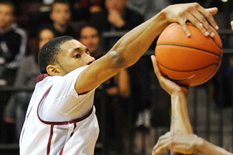 St. Joe's forward C.J. Aiken leads the nation in blocked shots with an average 4.8 per game. (Clem Murray/Staff Photographer)