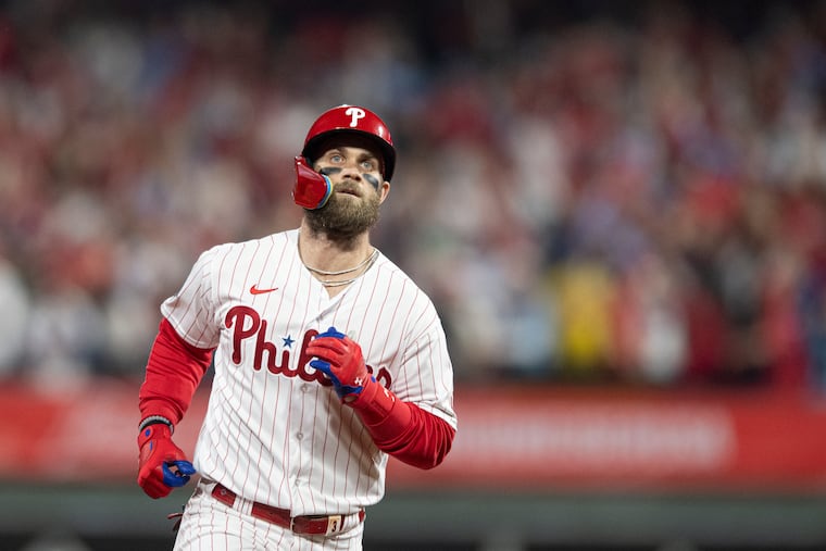 Bryce Harper rounds the bases after hitting a two-run homer for the Phillies in the first inning of Game 3 against the Astros.