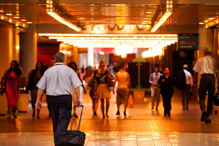 Pedestrians walk through the once-bustling Gallery on Market Street.. MICHAEL PRONZATO / Staff Photographer