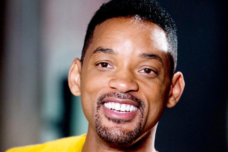 Will Smith smiles during a photo opportunity before the start of a press conference in Buenos Aires, Argentina, Wednesday, Nov. 20, 2013. (AP Photo/Natacha Pisarenko)
