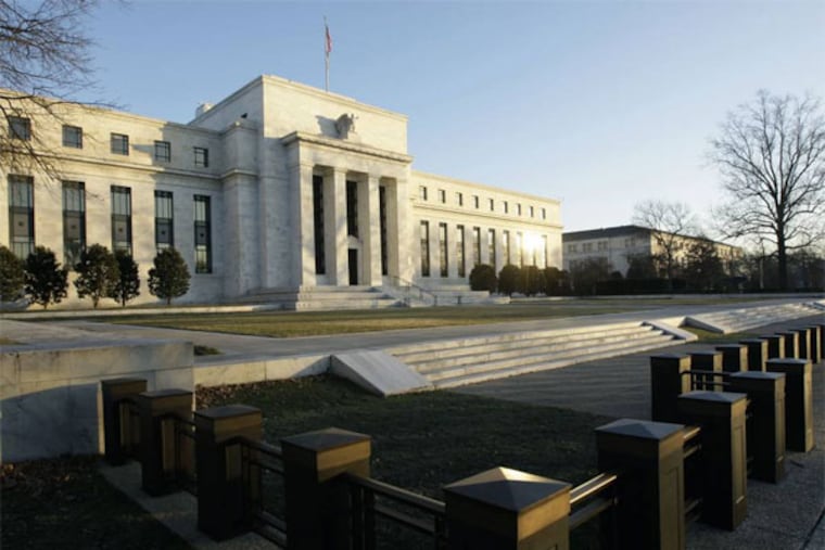 FILE - This Jab. 14, 2010 file photo shows the Federal Reserve Building in Washington. When the Federal Reserve offers its latest word on interest rates this week, few think it will telegraph the one thing investors have been most eager to know: When it will slow its bond purchases, which have kept long-term borrowing rates low. (AP Photo/Alex Brandon, File)