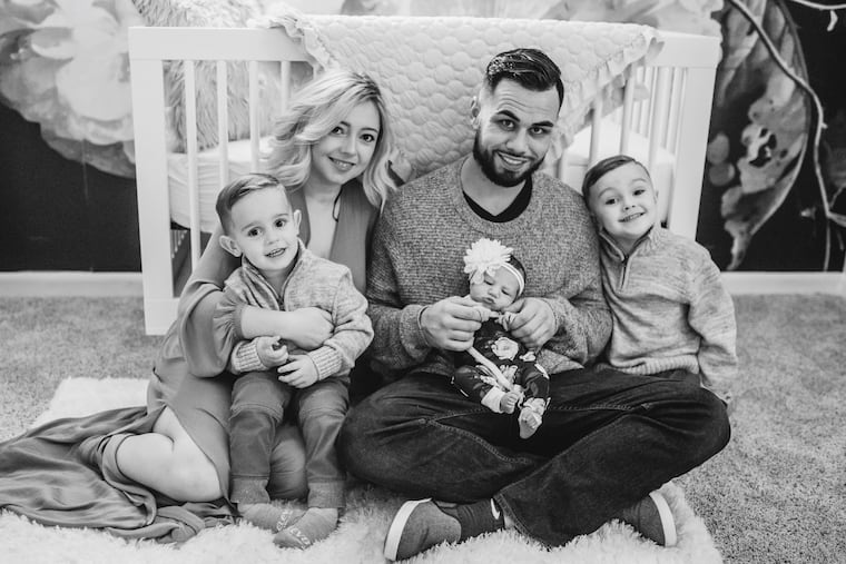 Brittany and Chris with Jace (left), Jaxon (right), and baby Adalei.