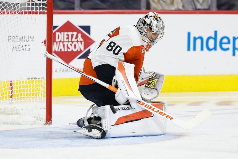 Flyers goaltender Dan Vladar stops the puck in the second period against the New Jersey Devils on Saturday.
