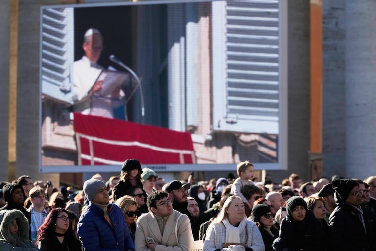 Faithful listen to Pope Leo XIV's Angelus noon prayer in St. Peter's Square at the Vatican on Sunday.