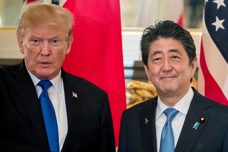 FILE - In this Nov. 6, 2017, file photo, U.S. President Donald Trump, left, and Japanese Prime Minister Shinzo Abe shake hands before a bilateral meeting at the Akasaka Palace in Tokyo. Trump will make a state visit to Japan at the end of May, 2019 to meet the nation's new emperor. (AP Photo/Andrew Harnik, File)