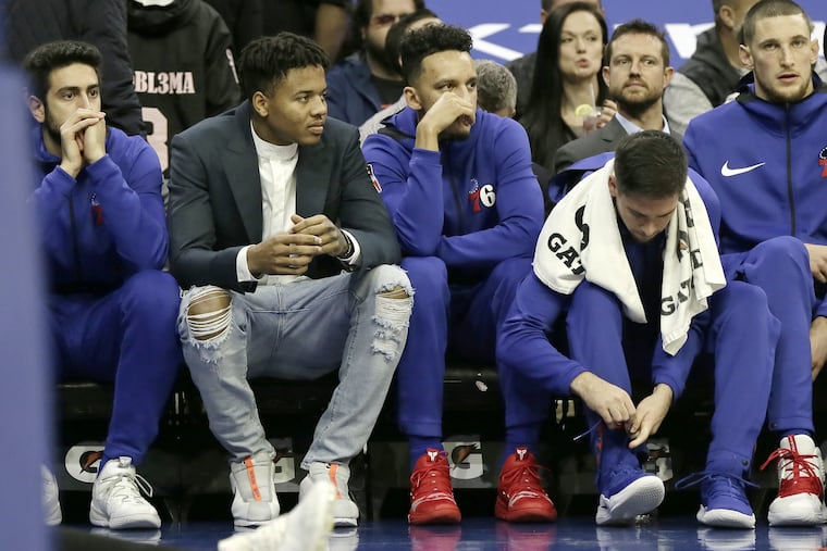 Sixers guard Markelle Fultz (ripped jeans) sits on the bench during the first quarter of Wednesday's game against New Orleans.